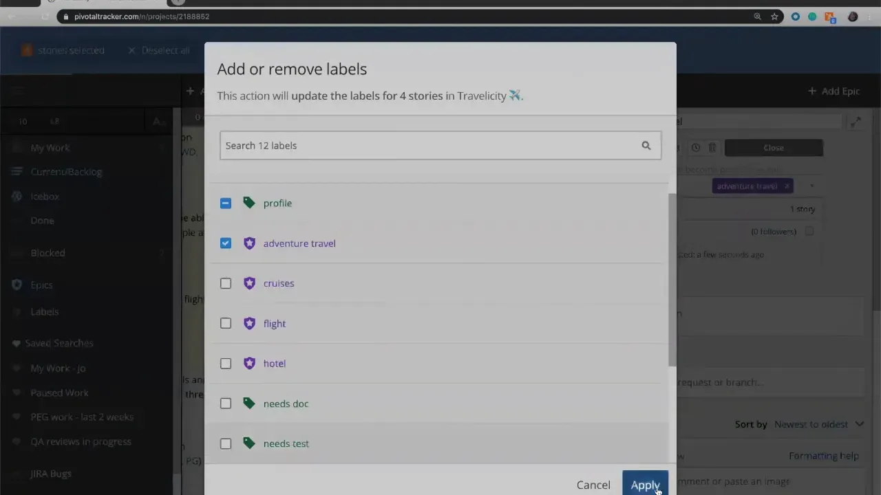 Add or remove labels modal with 'adventure travel' checked and Apply button ready to tag stories in LiteTracker.